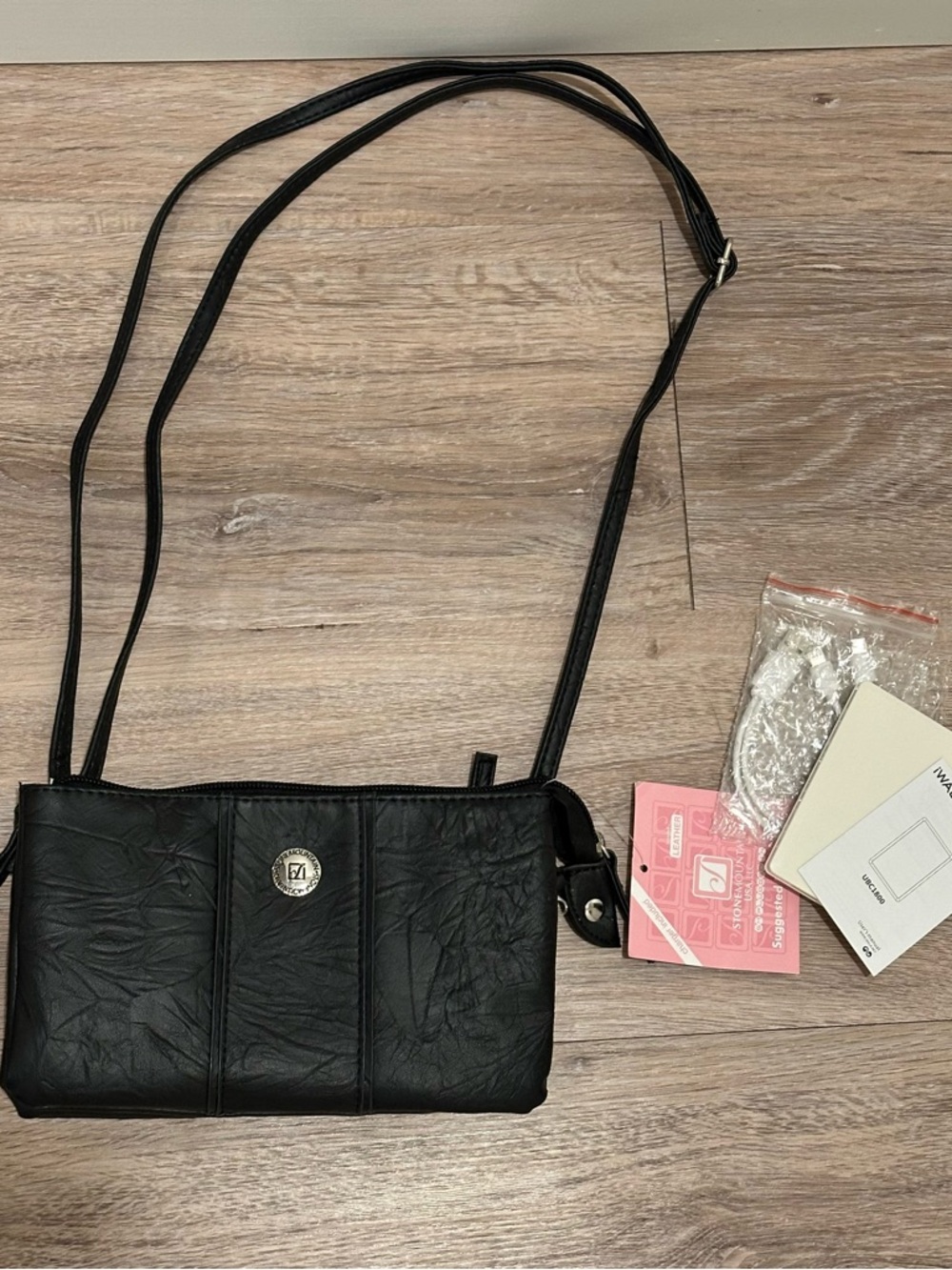 Brand new Stone Mountain Crossbody  Bag - tons of pockets & has phone charger